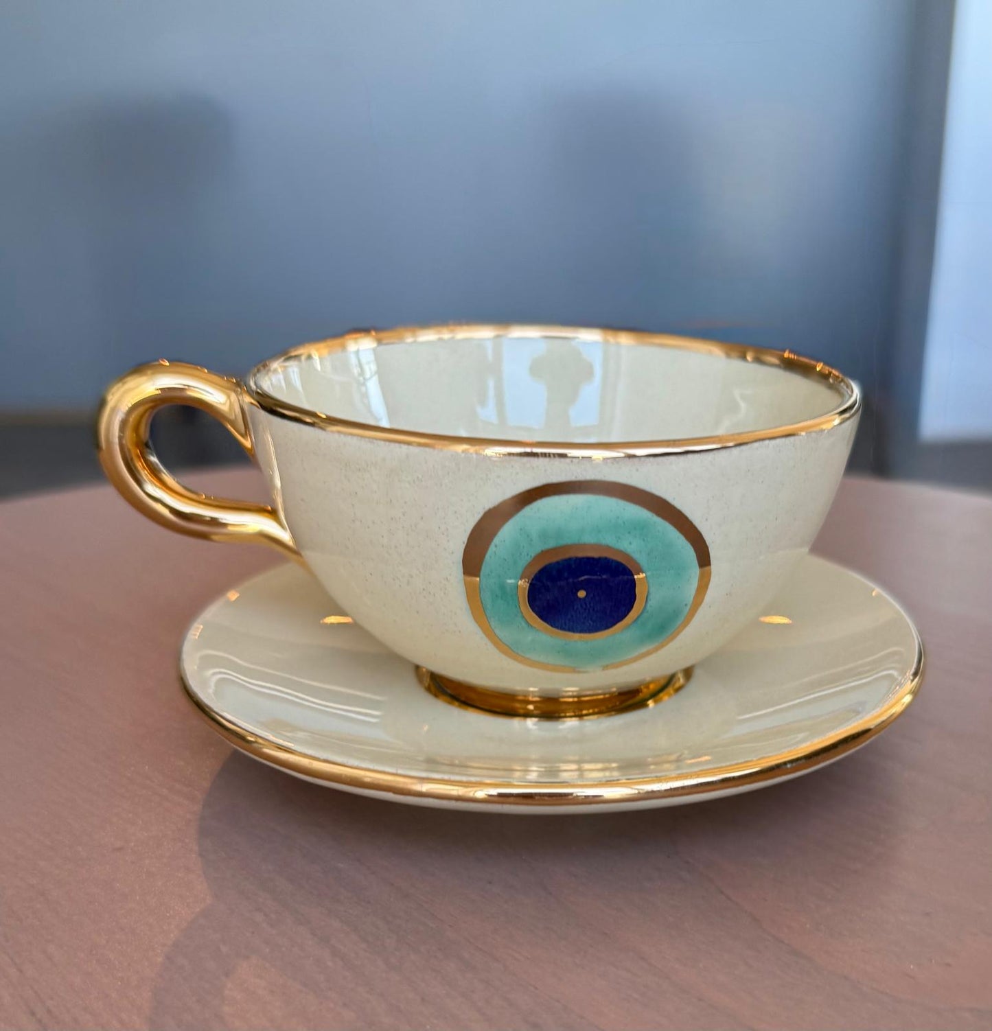 Evil Eye Ceramic cup and saucer Set- With Gold Plated Gold Handle