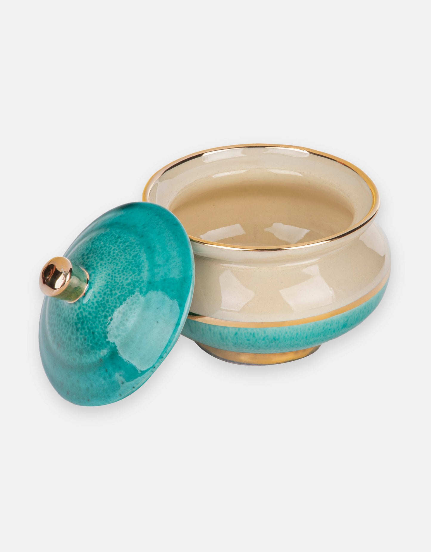 Glazed turquoise ceramic candy box with plating on the edge